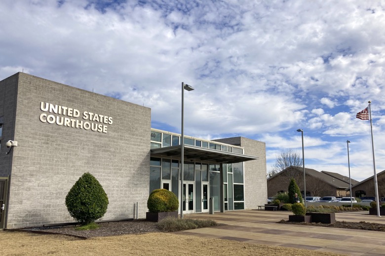 The federal courthouse in Plano, Texas, Friday, Jan. 14, 2022, where Stewart Rhodes, the founder and leader of the far-right Oath Keepers militia group, is set to make a first appearance in court on a seditious conspiracy charge. (AP Photo/Jake Bleiberg)