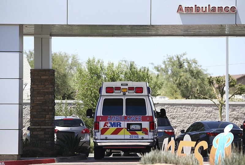 FILE - In this June 10, 2020, file photo, an ambulance is parked at Arizona General Hospital in Laveen, Ariz. (AP Photo/Ross D. Franklin, File)


