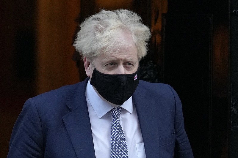 Britain's Prime Minister Boris Johnson leaves Downing Street to attend the weekly session of Prime Ministers Questions in London, Wednesday, Jan. 12, 2022. (AP Photo/Kirsty Wigglesworth)


