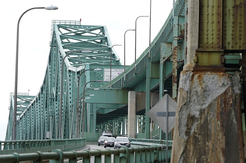 FILE - Drivers take an exit ramp off the Tobin Memorial Bridge, Wednesday, March 31, 2021, in Chelsea, Mass. (AP Photo/Steven Senne, File)


