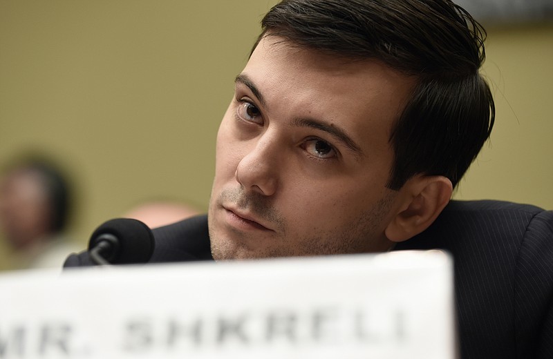 FILE - Former Turing Pharmaceuticals CEO Martin Shkreli attends the House Committee on Oversight and Reform Committee hearing on Capitol Hill in Washington, Feb. 4, 2016. A federal judge on Friday, Jan. 14, 2022 ordered Shkreli to return $64.6 million in profits he and his company reaped from inflating the price of the life-saving drug Daraprim and barred him from participating in the pharmaceutical industry for the rest of his life. (AP Photo/Susan Walsh, File)