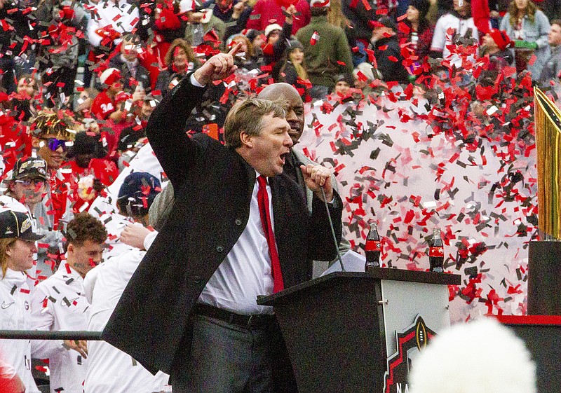 Atlanta Journal-Constitution photo by Steve Schaefer via AP / University of Georgia football coach Kirby Smart cheers on the crowd during Saturday's celebration of the Bulldogs' national championship at Sanford Stadium in Athens, Ga.