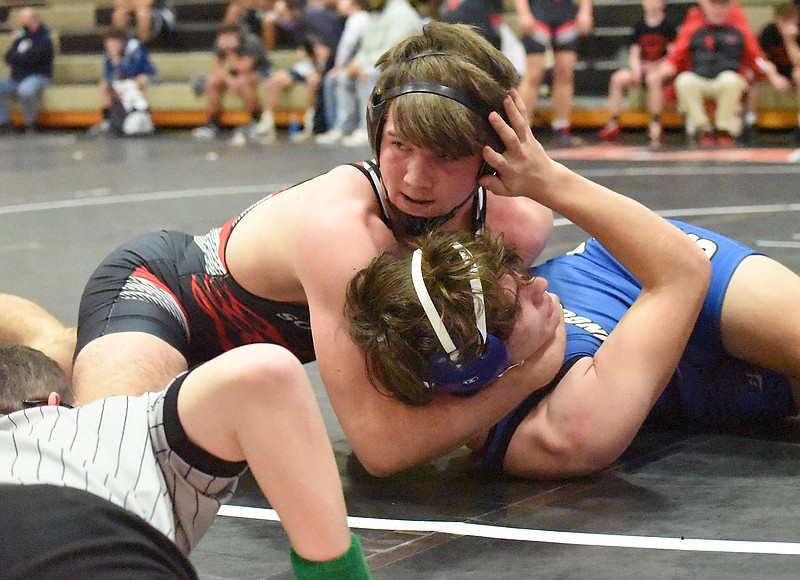 Staff file photo by Matt Hamilton / Sonoraville's Jebb Knight, top, and his teammates helped the Phoenix clinch a spot at state duals with a dominant performance during Saturday's preliminary at Sonoraville.
