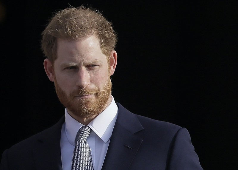 FILE - Britain's Prince Harry arrives in the gardens of Buckingham Palace in London, Jan. 16, 2020. Prince Harry has filed a claim for a judicial review against the British government's decision not to let him personally pay for police protection while in the U.K. The Duke of Sussex's legal representative said Saturday, Jan. 15, 2022 that Harry wants to bring his children Archie and Lilibet to visit his home country from the U.S. but that is too risky without police protection. (AP Photo/Kirsty Wigglesworth, File)