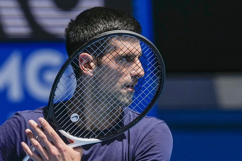 FILE - Defending champion Serbia's Novak Djokovic practices ahead of the Australian Open tennis championship in Melbourne, Australia, Jan. 12, 2022. Weary after two years of some of the harshest COVID-19 border restrictions in the world, many Australians wanted Djokovic kicked out of their country for traveling to the tennis tournament without being vaccinated. But the backdrop to the government's tough line on the defending Australian Open champion and Prime Minister Scott Morrison's description of the expulsion as a "decision to keep our borders strong" dates to nearly a decade ago. It also shines a light on Australia's complicated, and strongly criticized, immigration and border policies. (AP Photo/Mark Baker, File)