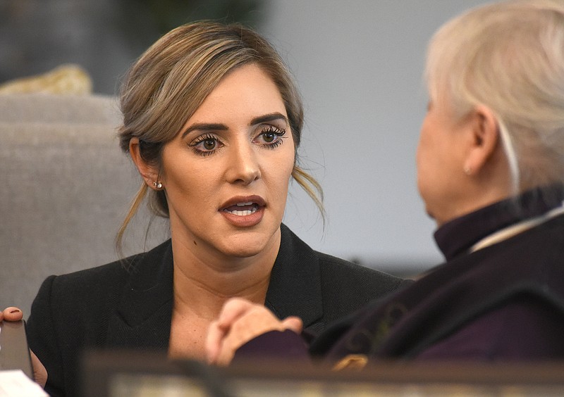 Staff Photo by Matt Hamilton / Coty Wamp talks to visitors before the start of the district attorney debate at the Red Stones Estates senior living facility on Tuesday, January 17, 2022.