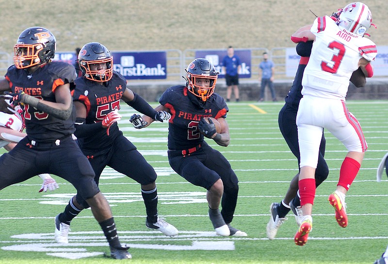 Staff Photo by Robin Rudd /  Game MVP Deandre Kelly (2) follows his blocking to score the Pirates's first touchdown.  The South Pittsburg Pirates defeated the McKenize Rebels to win the TSSAA Division 1 Class A  football championship in the BlueCross Bowl, at Finley Stadium, on December 3, 2021.