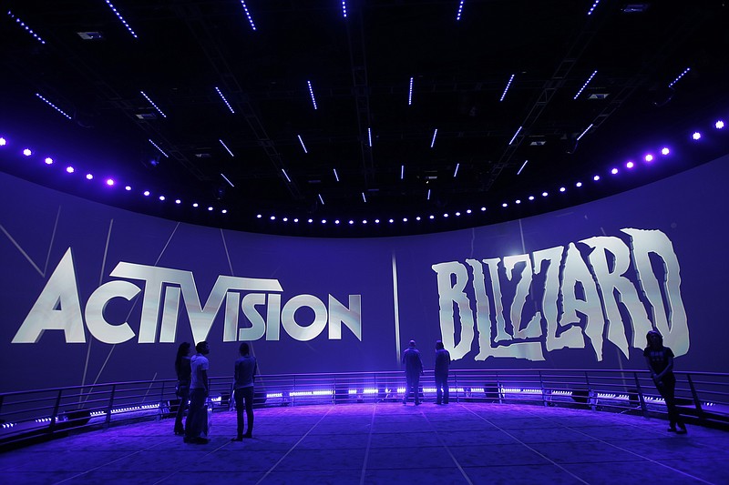 AP File Photo/Jae C. Hong / The Activision Blizzard Booth is shown on June 13, 2013 the during the Electronic Entertainment Expo in Los Angeles. Microsoft is buying Activision Blizzard, Tuesday, Jan. 18, 2022, for $68.7 billion to gain access to blockbuster games including Call of Duty and Candy Crush. The all-cash deal will let Microsoft accelerate mobile gaming and provide it building blocks for the metaverse, or a virtual environment.