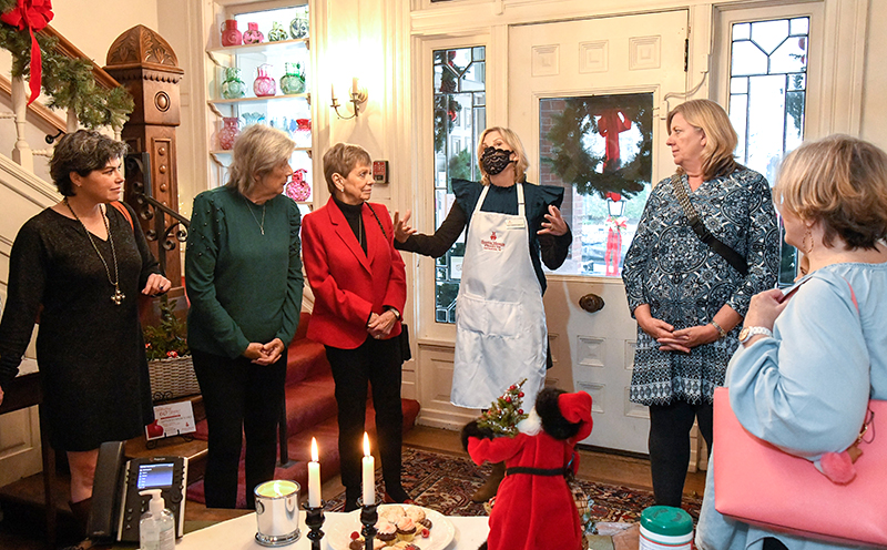 Photo by Mark Gilliland / Julia Dooley (center) gives a history of the museum.