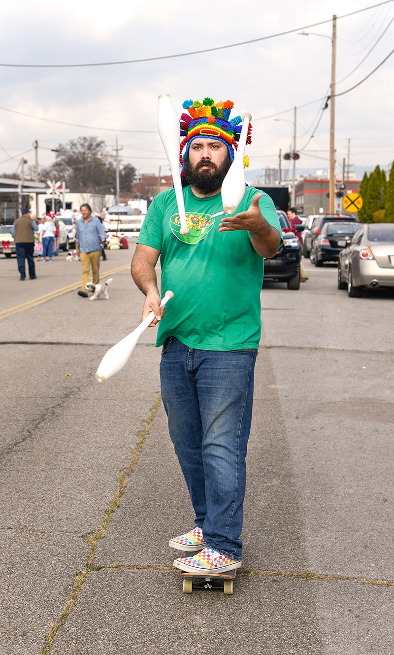 Photo by Mark Gilliland / Anthony Calderon juggles while riding a skateboard.