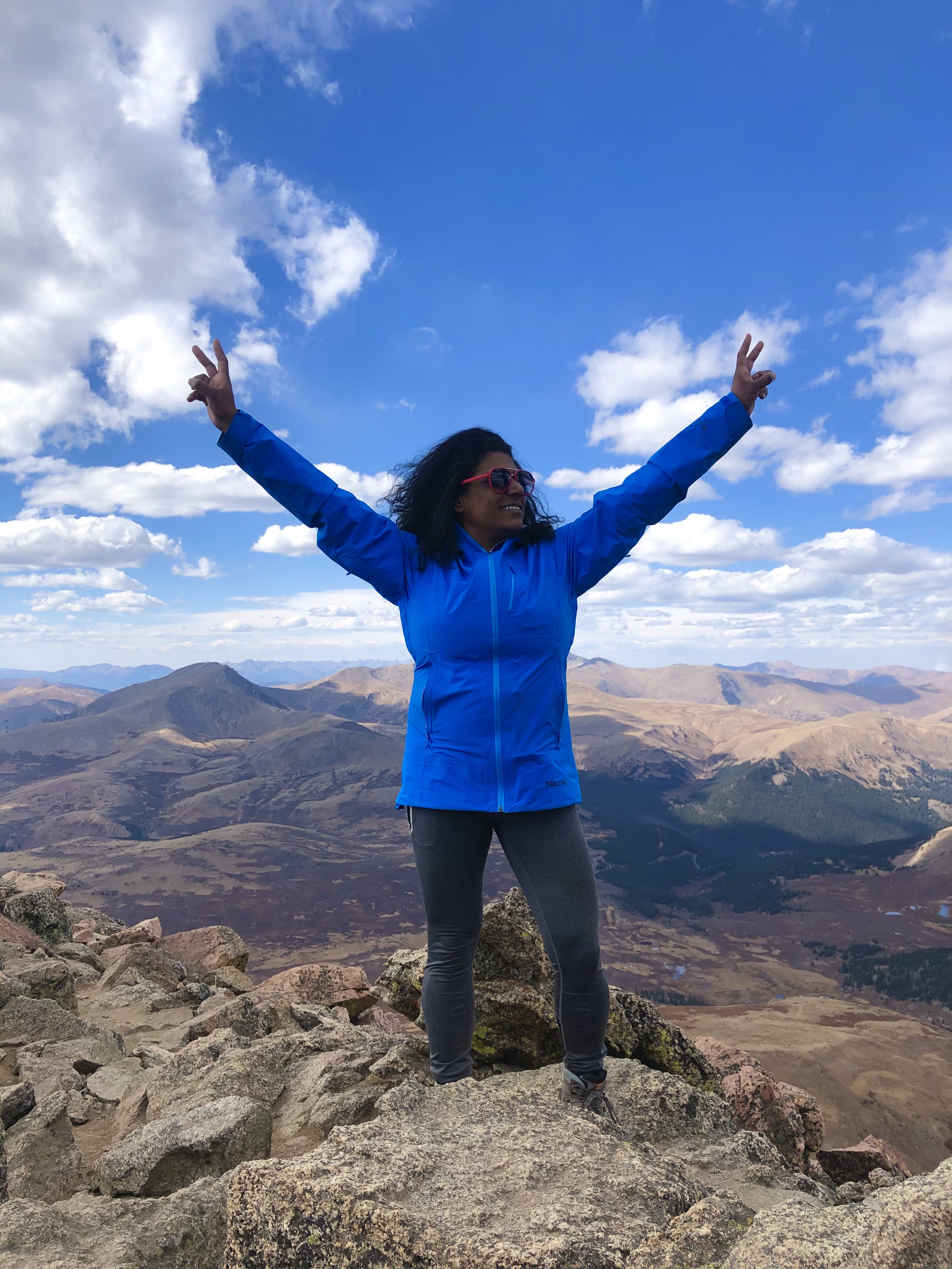 Photo contributed by Candace Litchfield / Candace Litchfield stands atop Mount Bierstadt in Colorado, which she hiked after finishing her remote work for the day.