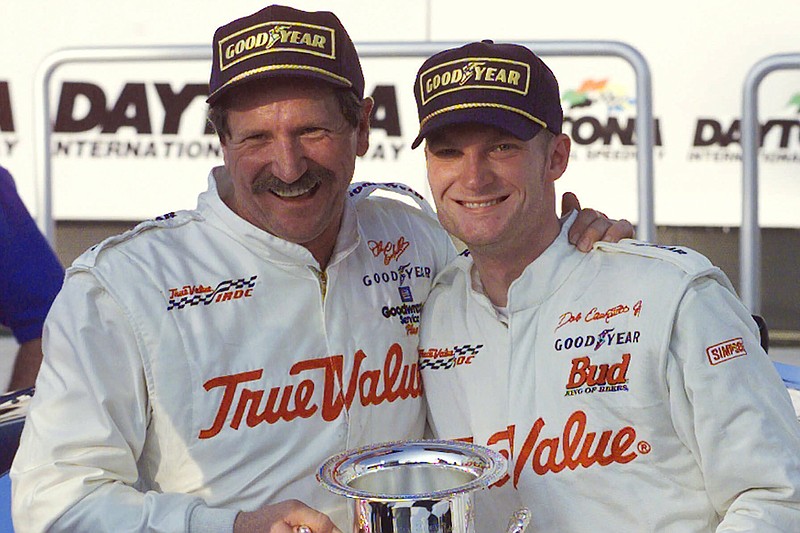 AP photo by Chris O'Meara / Dale Earnhardt, left, hugs Dale Earnhardt Jr. in victory lane at Daytona International Speedway on Feb. 18, 2000, after the elder Earnhardt won in IROC competition and Junior finished fifth. More than a decade after his father was a member of the NASCAR Hall of Fame's inaugural class of 2010, Dale Jr. will be inducted as the headlining member of the three-driver class of 2021 on Friday night in Charlotte, N.C.