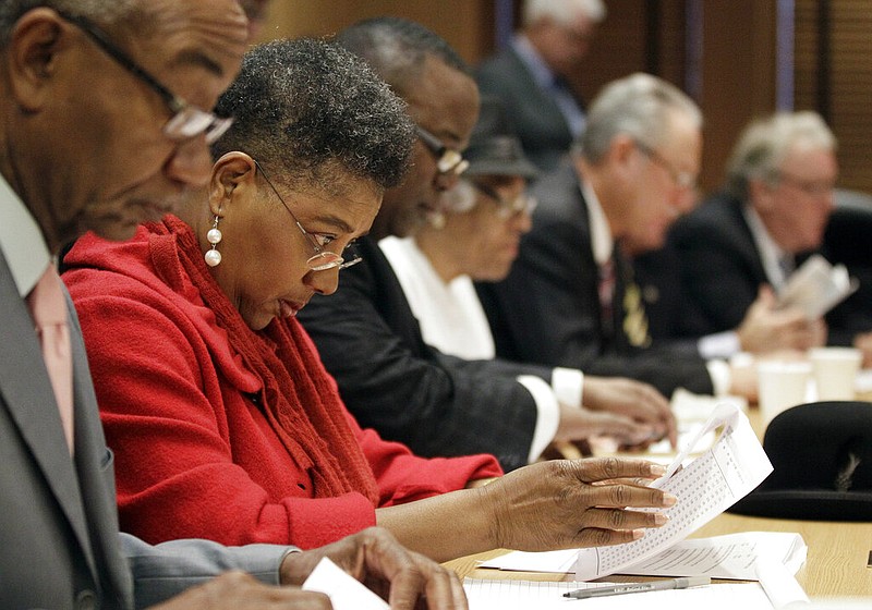 Rep. Brenda Gilmore, D-Nashvile, looks over a House Republican redistricting plan on Wednesday, Jan. 4, 2012, in Nashville, Tenn. The once-a-decade redistricting plan follows the 2010 Census and reflects shifting population and political trends. (AP Photo/Mark Humphrey)