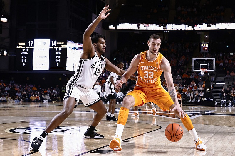 Tennessee forward Uros Plavsic (33) works for a shot as Vanderbilt forward Terren Frank (15) defends during the first half of an NCAA college basketball game Tuesday, Jan. 18, 2022, in Nashville, Tenn. (AP Photo/Wade Payne)