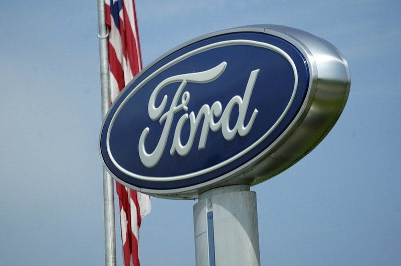 A Ford logo is seen on signage at Country Ford in Graham, N.C., Tuesday, July 27, 2021. (AP Photo/Gerry Broome)


