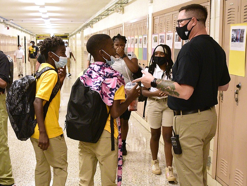 Staff file photo by Robin Rudd / Orchard Knob Middle School's sixth grade assistant principal, Travis Miller, right, directs students on Aug. 12, 2021.