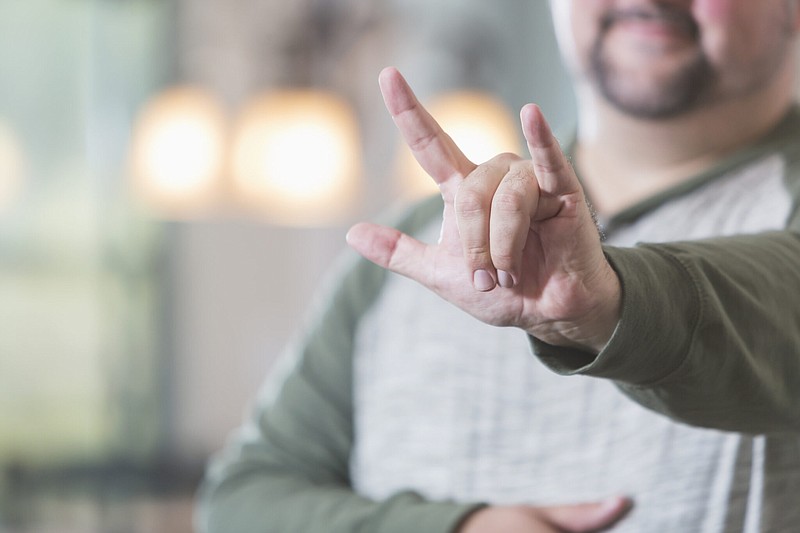 Two Tennessee departments are being sued for not providing access to American Sign Language interpreters. / Getty Images