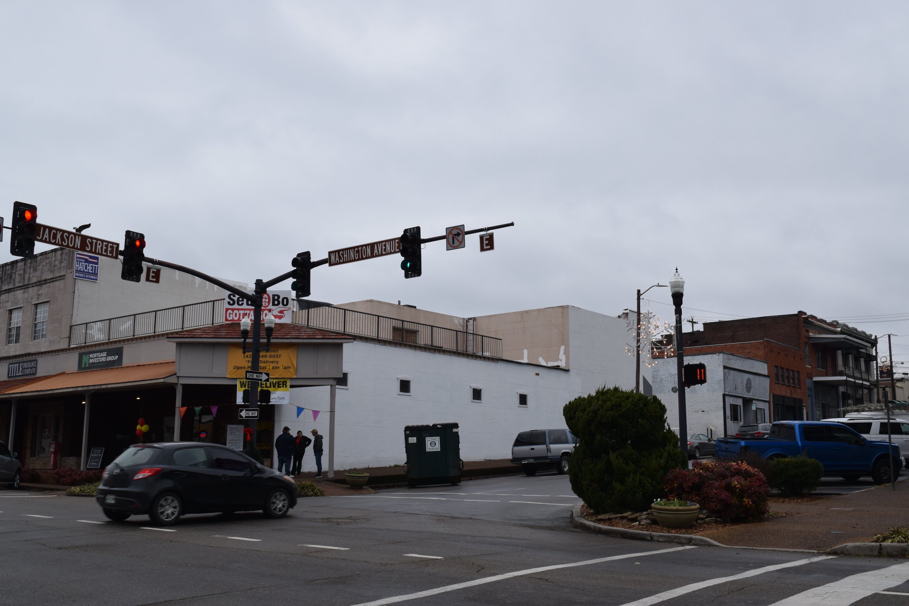 Staff photo by Ben Benton / A sign painted in 2019 on the side of Glenn Whiting's family's building on the McMinn County Courthouse square critical of the city of Athens, Tenn., and its police department led to a federal free speech lawsuit that ended in a mistrial on Tuesday. The sign has since been painted over.