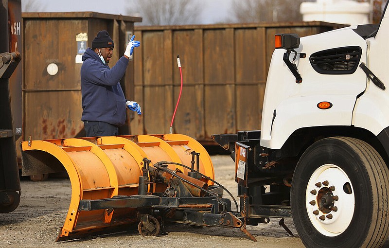 Virginia Beach, Va., Public Works crews prepare Thursday, Jan. 20, 2022, morning for snow from an impending winter storm. (Stephen M. Katz/The Virginian-Pilot via AP)