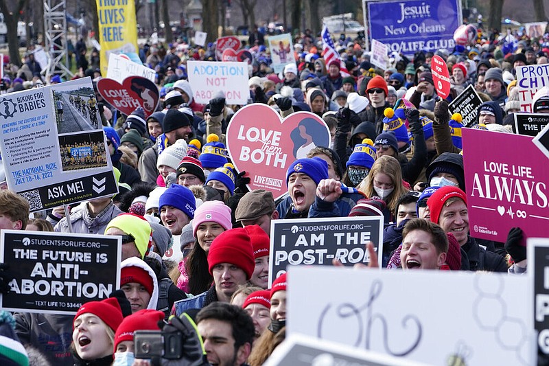 People attend the March for Life rally on the National Mall in Washington, Friday, Jan. 21, 2022. The March for Life, for decades an annual protest against abortion, arrives this year as the Supreme Court has indicated it will allow states to impose tighter restrictions on abortion with a ruling in the coming months. (AP Photo/Susan Walsh)