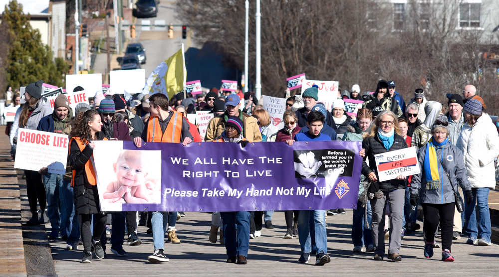 Staff Photo by Robin Rudd / Saturday's March for Life moves south on the Walnut Street Bridge.