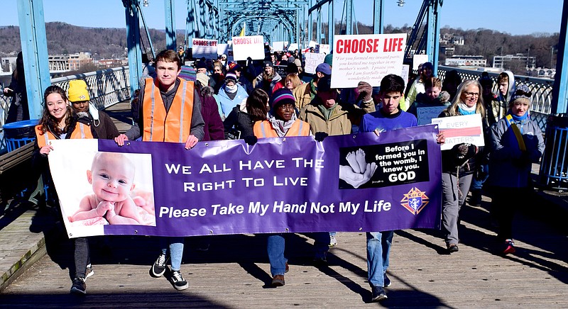 Staff Photo by Robin Rudd / Saturday's March for Life moves south on the Walnut Street Bridge.