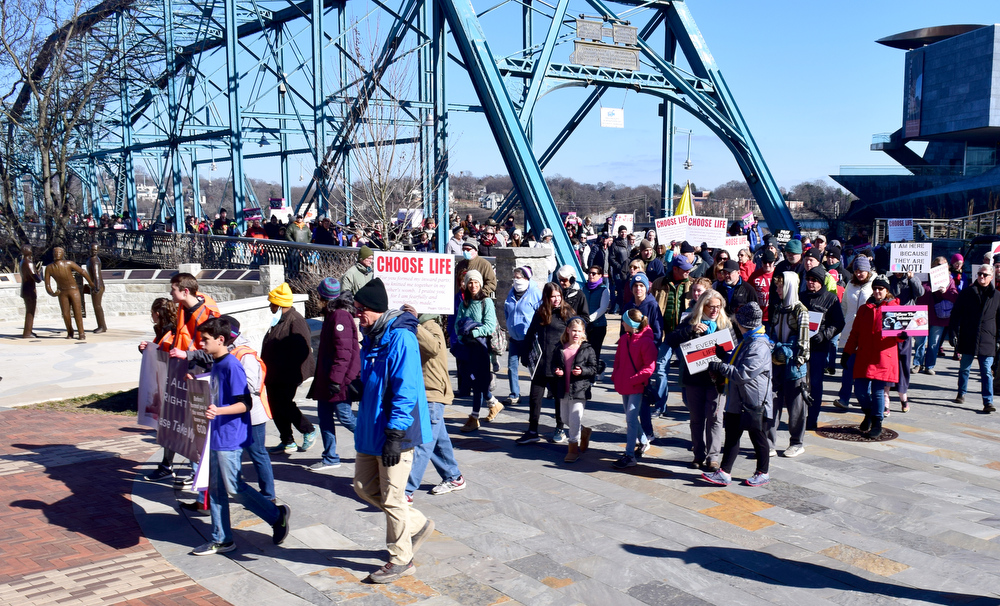 Staff Photo by Robin Rudd / Saturday's March for Life turns west after crossing the Walnut Street Bridge.