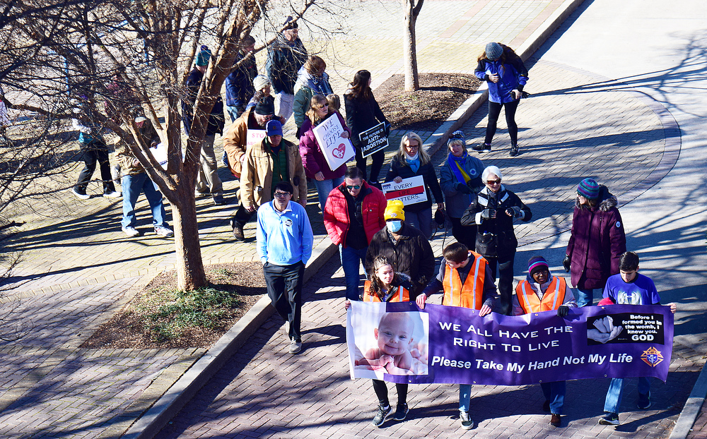 Staff Photo by Robin Rudd / The March for Life moves from the Walker Pavilion to the Walnut Street Bridge on Saturday.