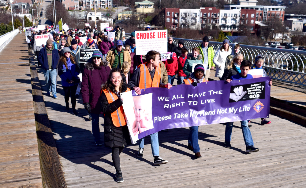 Staff Photo by Robin Rudd / Saturday's March for Life moves south on the Walnut Street Bridge. The route was from Coolidge Park across the Walnut Street Bridge, to the Market Street Bridge and ending at Coolidge Park.