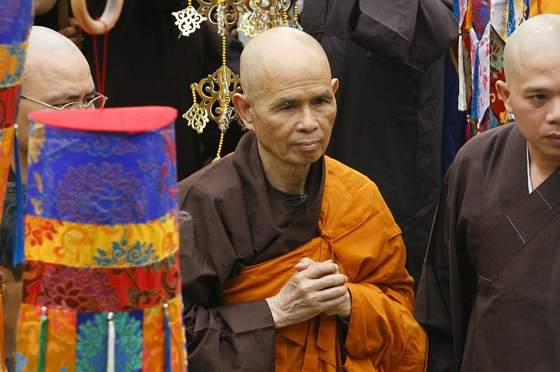 FILE - Vietnamese Zen master Thich Nhat Hanh, center, arrives for a great chanting ceremony at Vinh Nghiem Pagoda in Ho Chi Minh City, Vietnam on March 16, 2007. (AP Photo, File)


