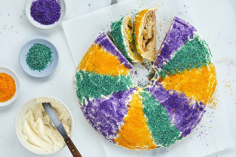 A king cake, from chef Dominick Lee, in New York. More than a dessert, the colorful cake imparts the flavor of the New Orleans. / Photo by Beatriz Da Costa/The New York Times