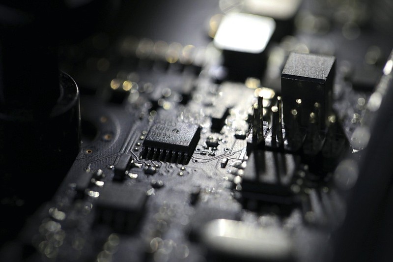 FILE - This Feb 23, 2019, photo shows the inside of a computer. A key part of President Joe Biden's plans to fight major ransomware attacks and digital espionage campaigns has been languishing for more than eight months.(AP Photo/Jenny Kane, File)