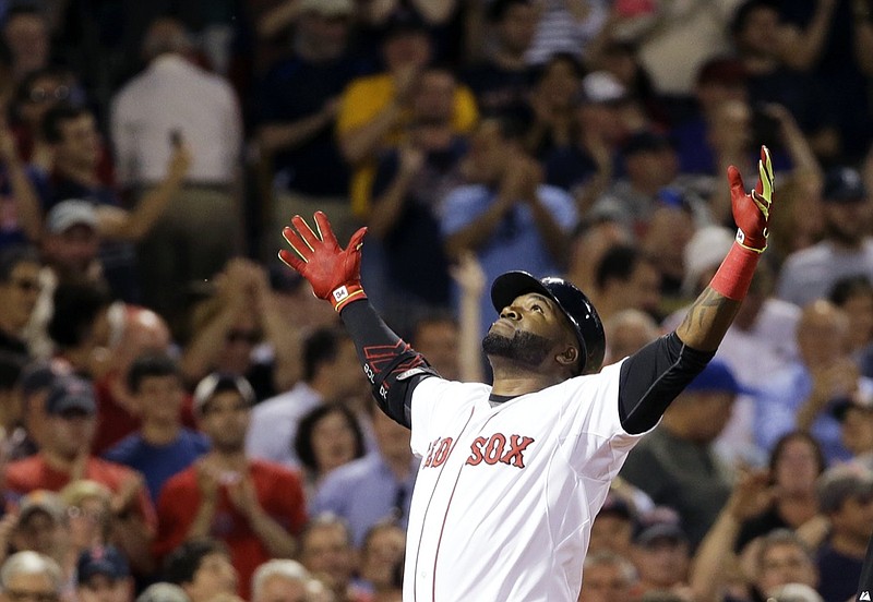 FILE - Boston Red Sox designated hitter David Ortiz reacts as he crosses home plate after hitting a two-run home run during the sixth inning of a baseball game against the Baltimore Orioles on June 24, 2015, at Fenway Park in Boston. Ortiz was elected to the National Baseball Hall of Fame on Tuesday, Jan 25, 2022. (AP Photo/Elise Amendola, File)