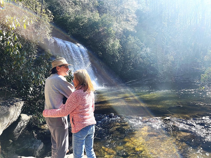 A couple enjoy the view at Silver Run Falls in Cashiers, N.C. / Photo by Anne Braly