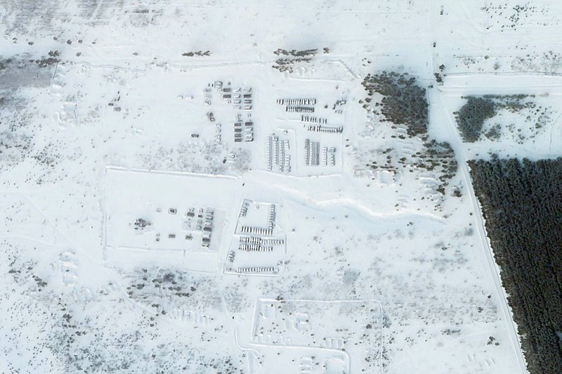 This satellite image provided by Planet Labs PBC shows vehicles and tanks stationed at the Pogonovo training area just south of the city of Voronezh, Russia, Wednesday, Jan. 26, 2022. (Planet Labs PBC via AP)


