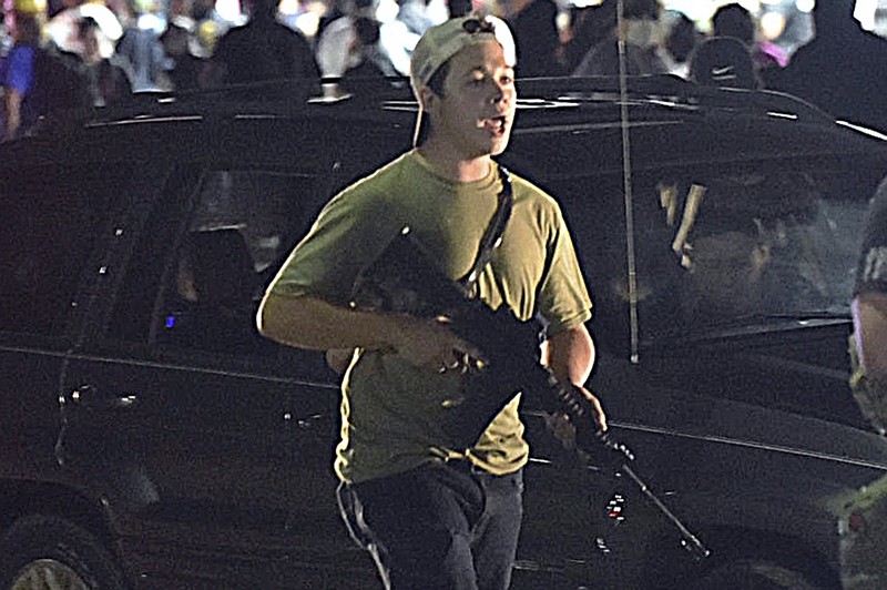 FILE - Kyle Rittenhouse walks along Sheridan Road in Kenosha, Wis., in this Aug. 25, 2020 file photo. (Adam Rogan/The Journal Times via AP, File)


