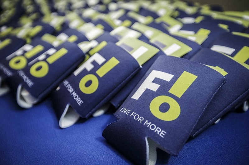 Beverage sleeves with the city of Florence's new logo sit out for guests to take home following a reveal at the Shoals Community Theatre, Tuesday, Jan. 25, 2022, in Florence, Ala. (Dan Busey/The TimesDaily via AP)


