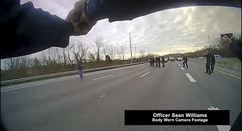 This still image from police body cam released by Metropolitan Nashville Police Department shows officers pleading with a man to surrender before shooting him on Jan. 28, 2022 in Nashville, Tenn. (Metropolitan Nashville Police Department via AP)


