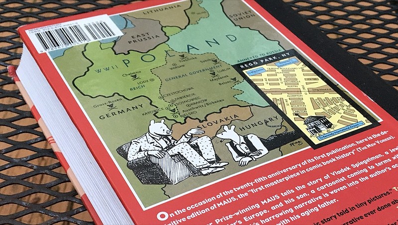 The back cover of The Complete Maus, a Holocaust novel by Art Spiegelman. The book tells the story of Vladek Spiegelman's experience of surviving in Hitler's Europe. / Staff photo by Kim Sebring	
