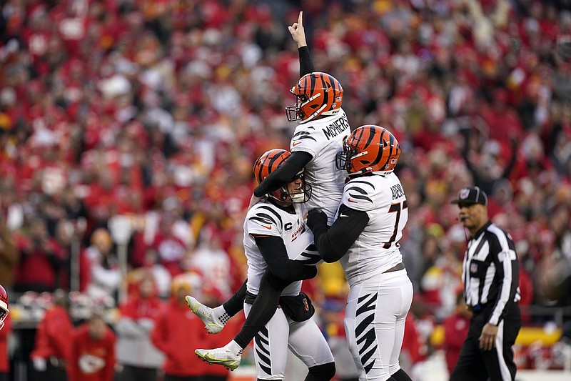 AP photo by Eric Gay / Cincinnati Bengals kicker Evan McPherson is lifted by teammates after making a 31-yard field goal for a 27-24 overtime victory against the host Kansas City Chiefs in Sunday's AFC championship game.