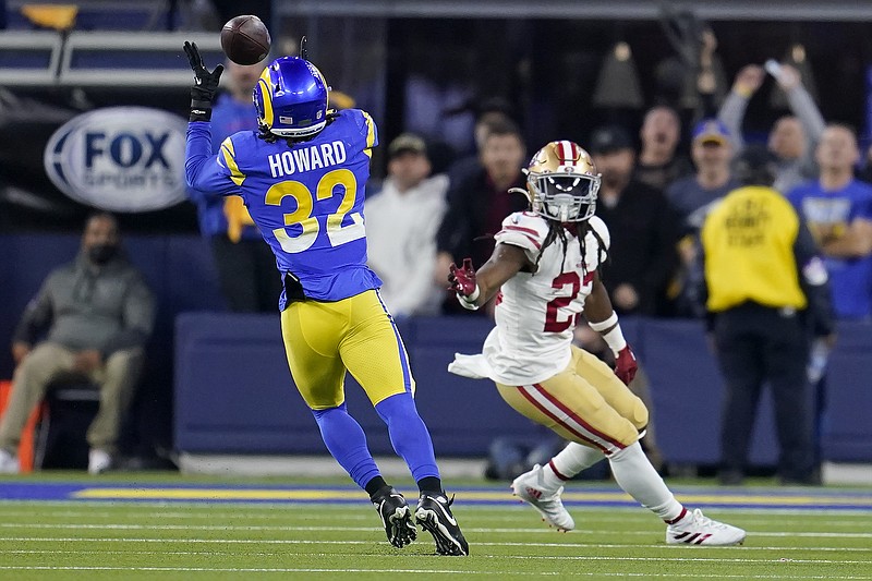 AP photo by Marcio Jose Sanchez / Los Angeles Rams linebacker Travin Howard intercepts a pass intended for the San Francisco 49ers' JaMycal Hasty during the second half of the NFC title game Sunday in Inglewood, Calif.