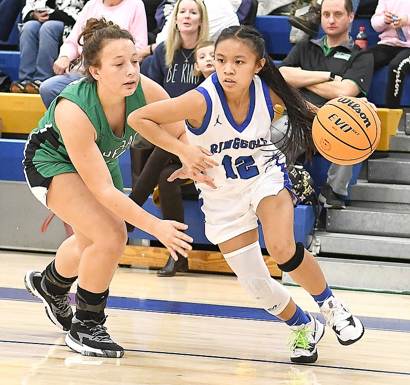 Staff Photo by Robin Rudd / Ringgold's Rachel Lopez (12) drives the baseline.  The Ringgold Tigers hosted the Murray County Indians in girls' GHSA basketball on February 1, 2022.  