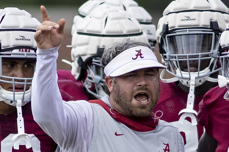 AP photo by Vasha Hunt / Alabama defensive coordinator Pete Golding works with players during a preseason practice this past August in Tuscaloosa.