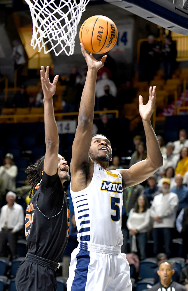 Staff Photo by Robin Rudd / Darius Banks (5) scores from under the basket. The University of Tennessee at Chattanooga Mocs hosted the Mercer Bears in Southern Conference basketball, at McKenzie Arena, on February 5, 2022.