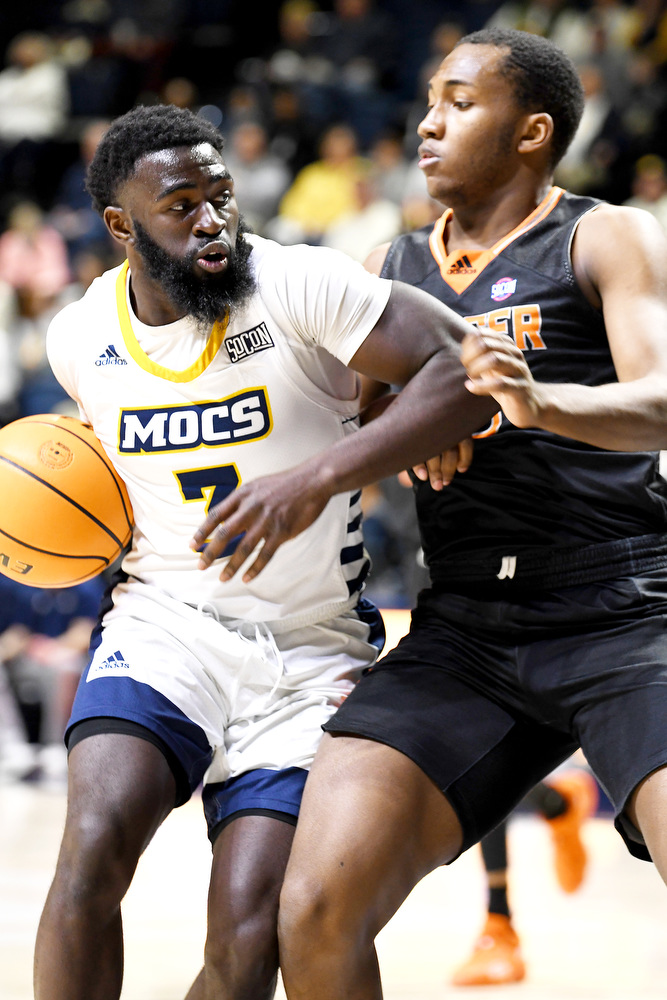 Staff Photo by Robin Rudd / UTC's David Jean-Baptiste (3) drives against a Mercer defender. The University of Tennessee at Chattanooga Mocs hosted the Mercer Bears in Southern Conference basketball, at McKenzie Arena, on February 5, 2022.