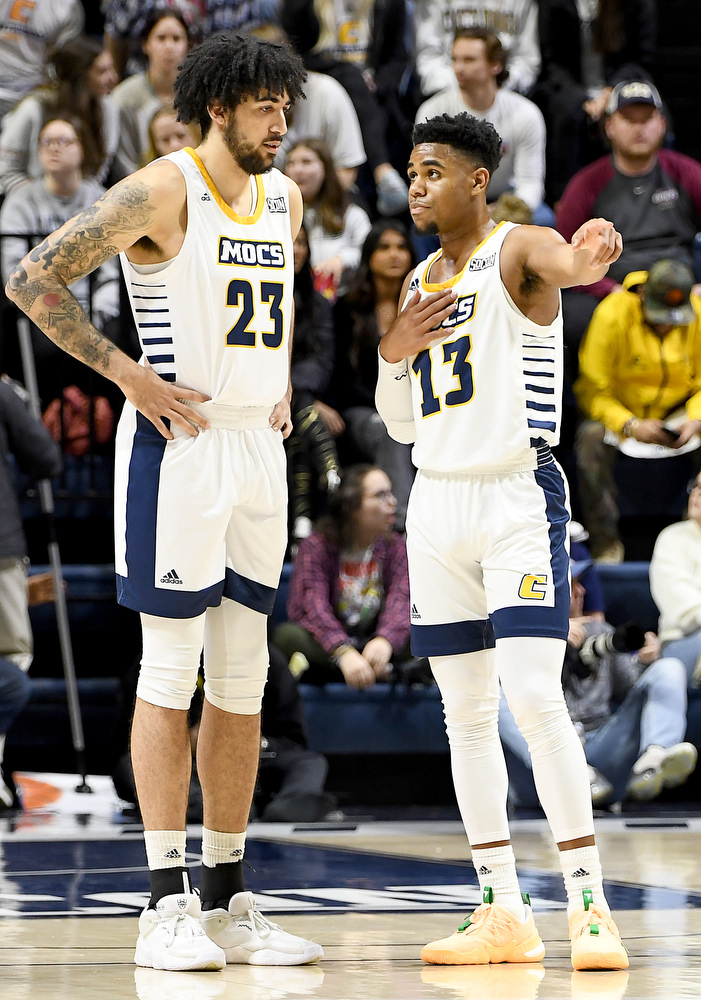 Staff Photo by Robin Rudd / UTC's Avery Diggs (23) and Malachi Smith (13) confer. The University of Tennessee at Chattanooga Mocs hosted the Mercer Bears in Southern Conference basketball, at McKenzie Arena, on February 5, 2022.