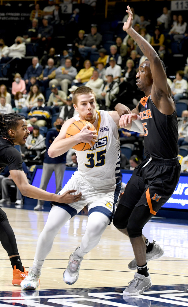 Staff Photo by Robin Rudd / UTC's Grant Ledford (35) drives between two Bear defenders. The University of Tennessee at Chattanooga Mocs hosted the Mercer Bears in Southern Conference basketball, at McKenzie Arena, on February 5, 2022.