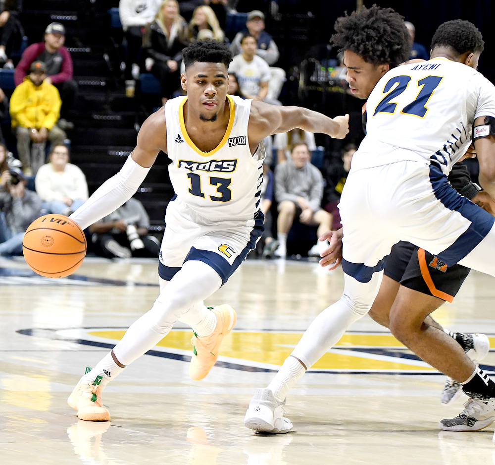 Staff Photo by Robin Rudd / UTC's Malachi Smith (13) drives around the pick of Josh Ayeni (21). The University of Tennessee at Chattanooga Mocs hosted the Mercer Bears in Southern Conference basketball, at McKenzie Arena, on February 5, 2022.