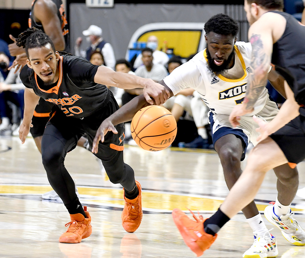 Staff Photo by Robin Rudd / Mercer's Jalen Johnson (20) and UTC's David Jean-Baptiste (3) go after a loose ball. The University of Tennessee at Chattanooga Mocs hosted the Mercer Bears in Southern Conference basketball, at McKenzie Arena, on February 5, 2022.