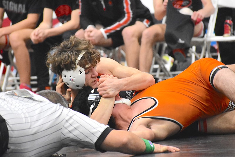 Staff photo by Patrick MacCoon / Signal Mountain's Noah Shriner pins a Pigeon Forge opponent at Saturday's TSSAA state Class A state duals in Franklin, Tenn.